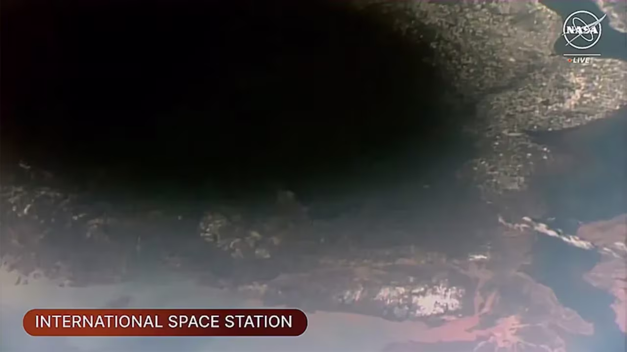 The Moon’s shadow, or umbra, on Earth was visible from the space station as it orbited into the path of the solar eclipse over southeastern Canada.