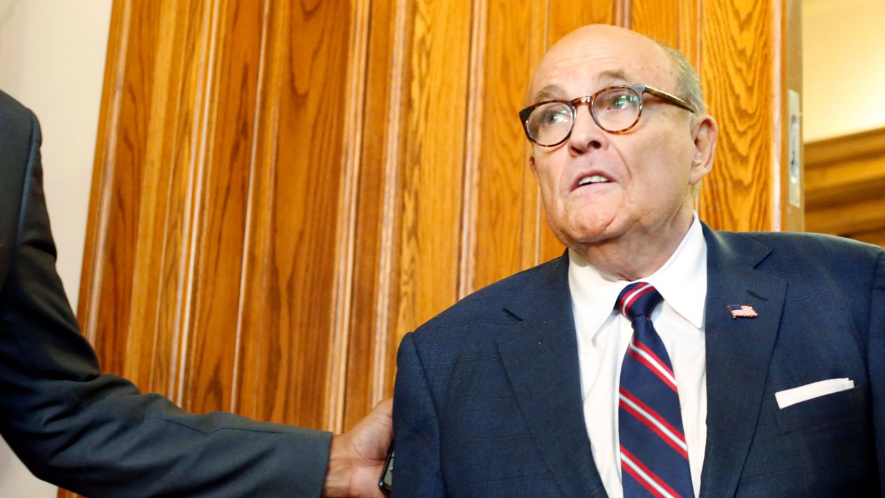 Rudy Giuliani walks to a senate hearing at the Georgia State Capitol in Atlanta on Thursday, December 3, 2020.