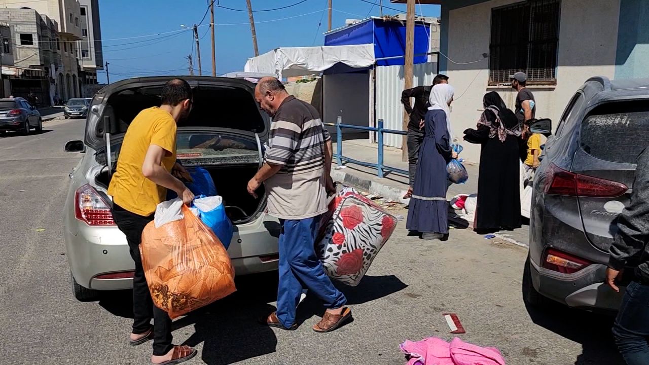 Palestinians pack a car as they leave Northern Gaza on Friday.