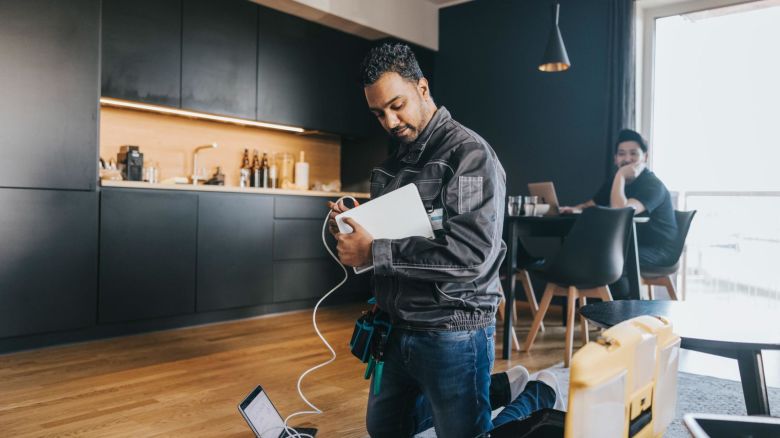 Technician runs wired internet connection to a tablet.