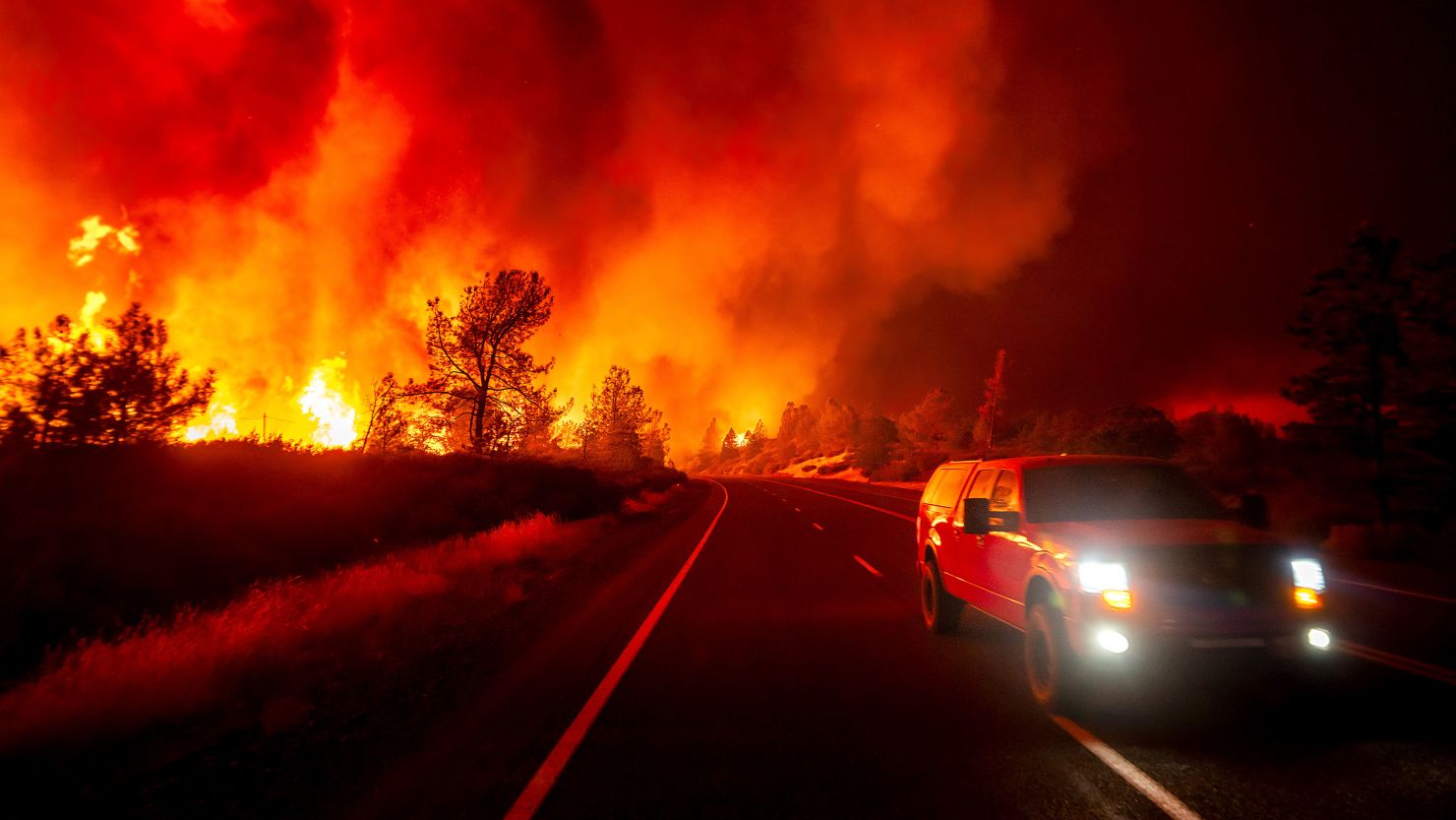 Smoke rises above the roadway as the Park Fire jumps Highway 36 near Paynes Creek in Tehama County, Calif., on Friday, July 26, 2024.