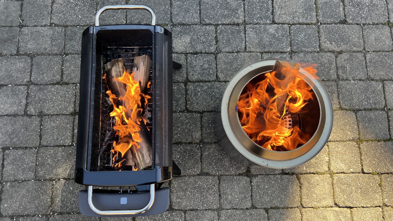 The Solo Stove Ranger 2.0 (right) burned bigger and faster, but standard firewood sticks out the top of the pit.