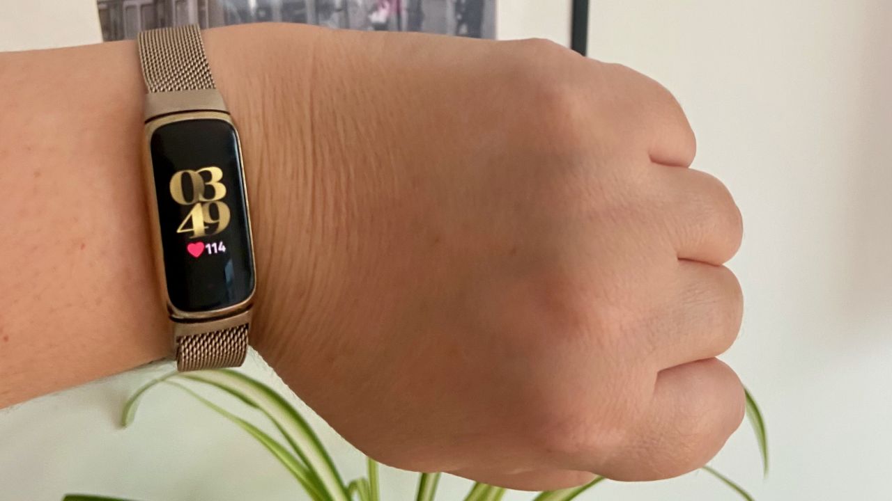 A photo of a Fitbit Luxe on a person's wrist