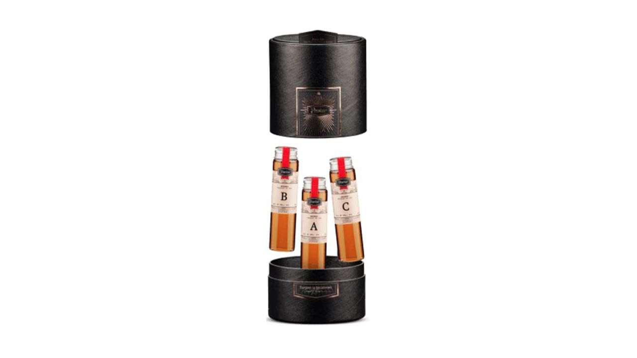 Three whiskey samples on a white background.