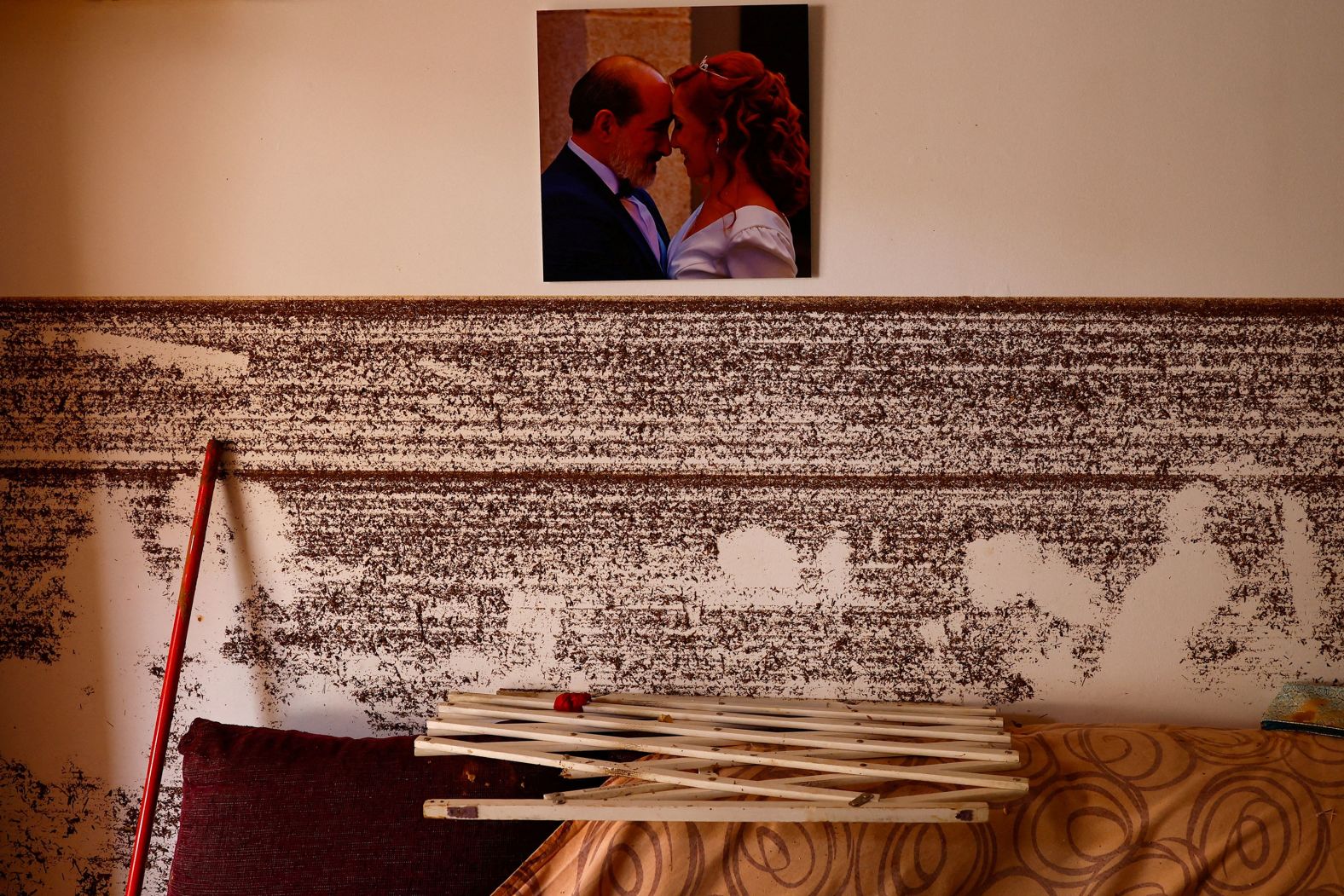 A wedding portrait of Blanca Ruiz and Carlos Calmaestra is seen undamaged right above the water marks at their home in Godelleta on Thursday.