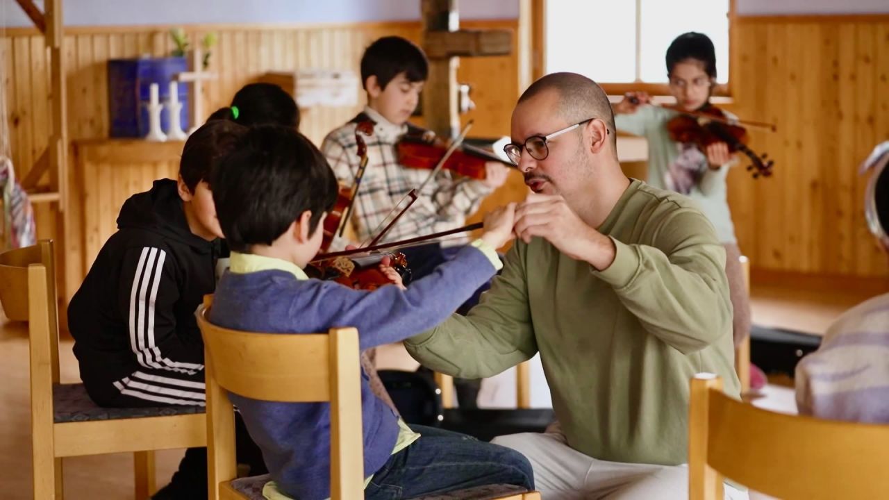 His love of music is helping refugees and immigrants build new lives