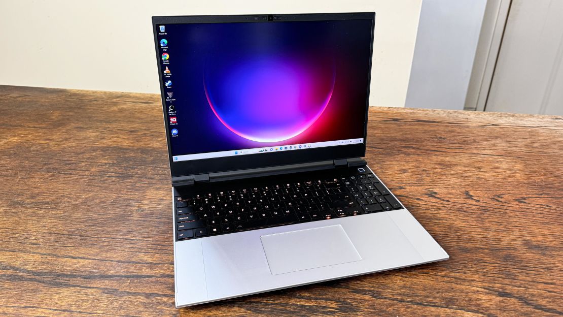 The Framework Laptop 16 with a purple and pink desktop background