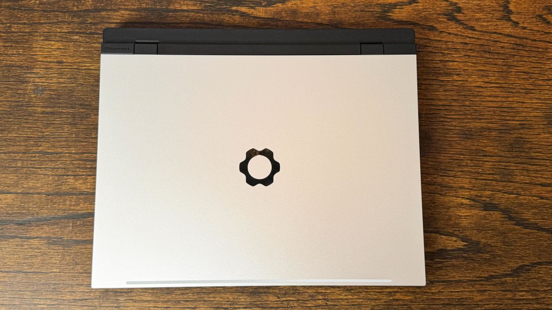 The closed Framework Laptop 16 shows its shiny gear logo