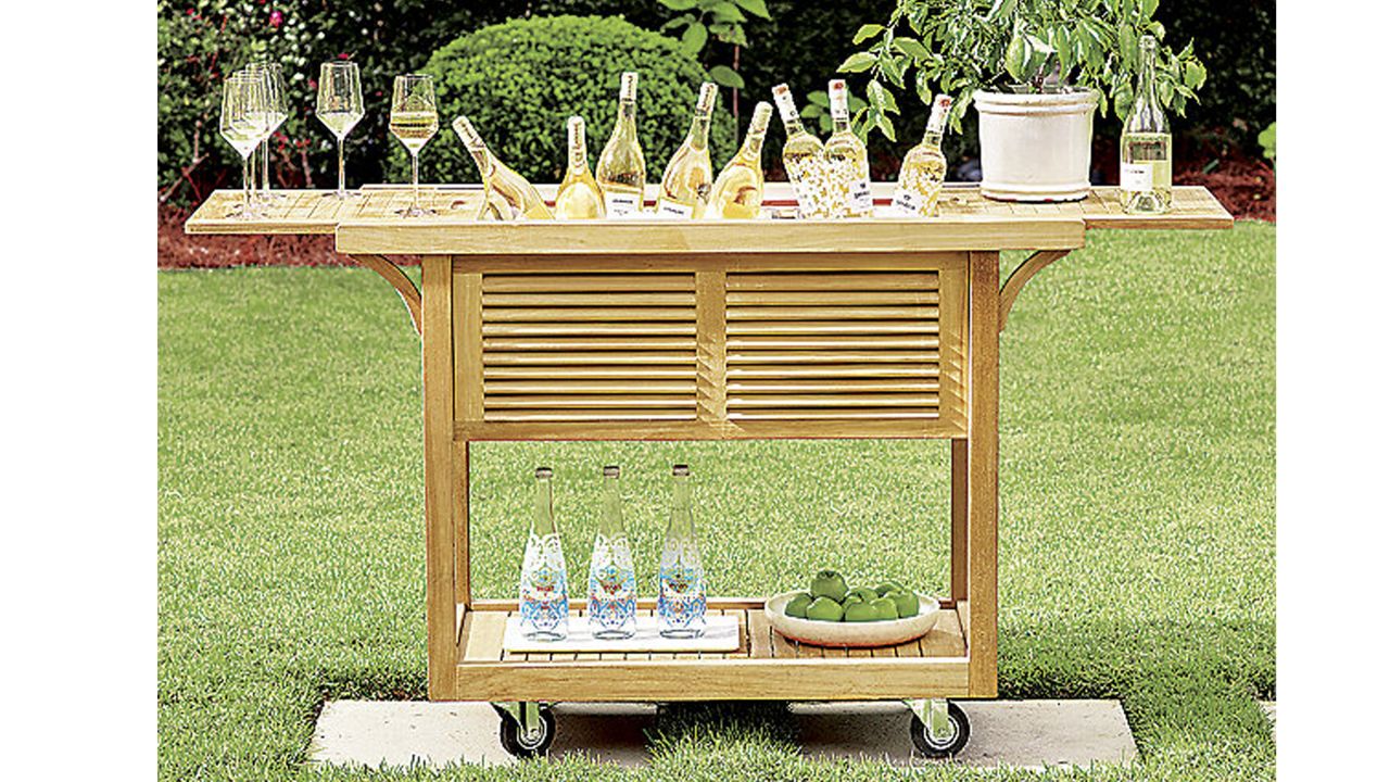 Frontgate teak bar cart in backyard