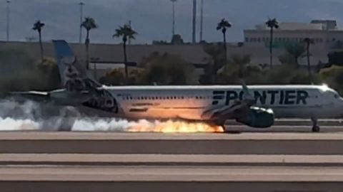 Video captured the moment when fire was seen underneath a Frontier flight as it landed at Harry Reid International Airport in Las Vegas.