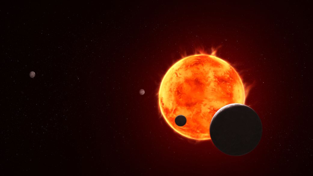 An Earth-size exoplanet 40 light years away called TRAPPIST-1 e, at the lower right in this illustration, could have an atmosphere capable of sustaining liquid water.
