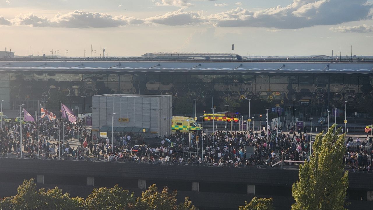 Crowds gathered outside Heathrow Terminal 4 after the check-in area was briefly evacuated due to a possible hazardous materials incident on Monday.