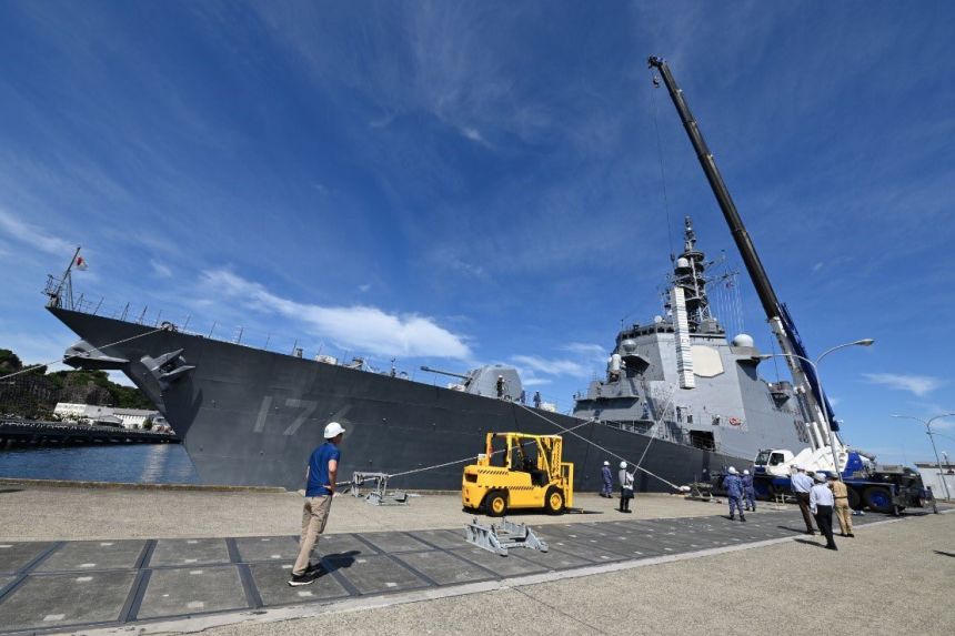 Crews in Japan practice loading a dummy Tomahawk munition aboard the Japan Maritime Self-Defense Force destroyer JS Chokai at Yokosuka Naval Base near Tokyo last week.