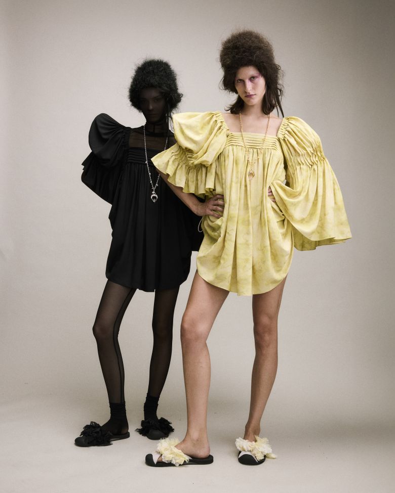 Collina Strada model duos posing backstage.