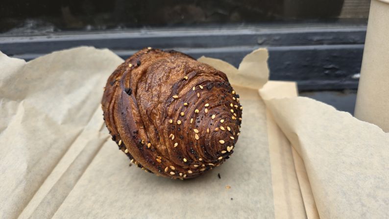 an everything croissant spiral on a piece of craft paper