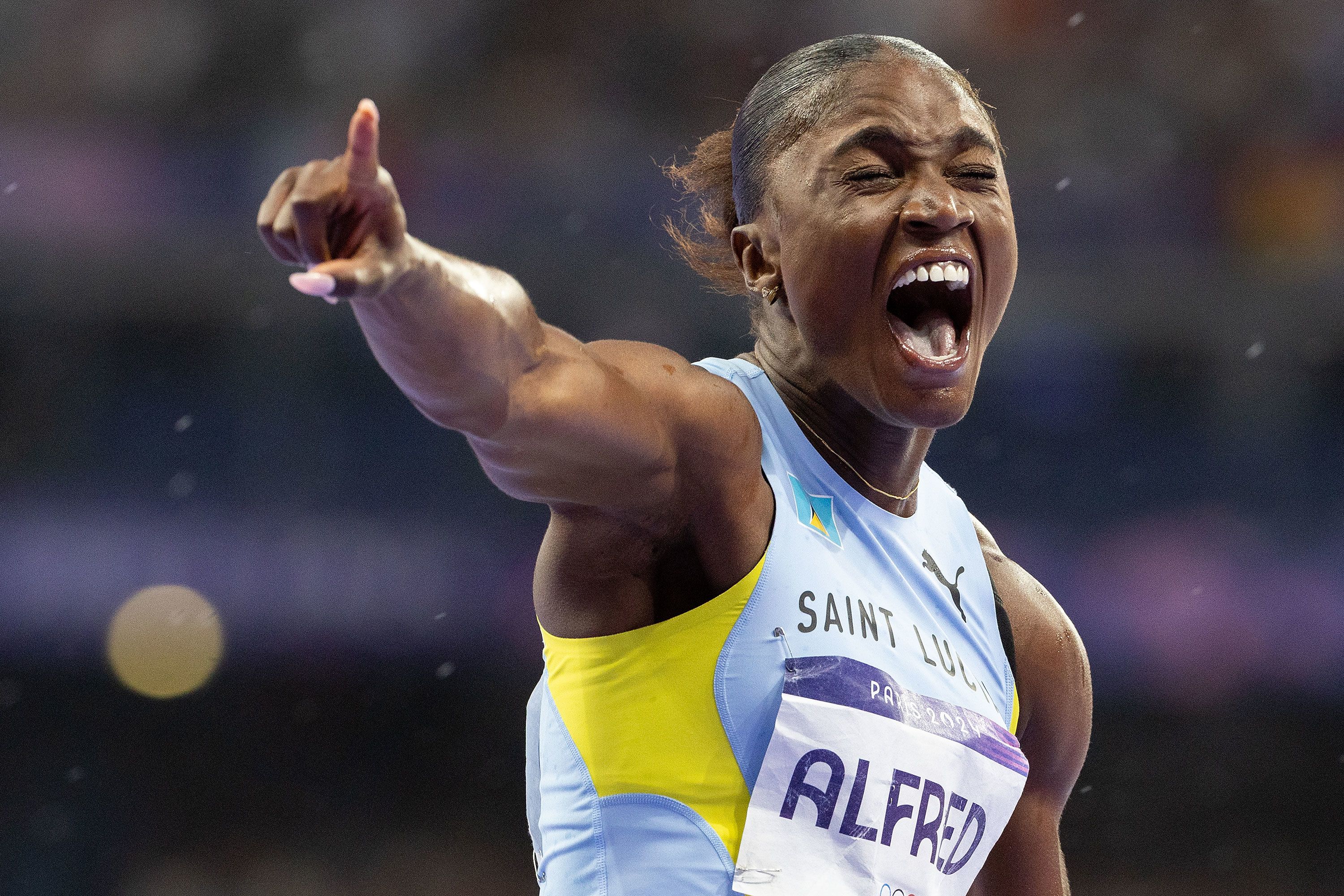 Saint Lucia's Julian Alfred celebrates after <a href="https://www.cnn.com/sport/live-news/paris-olympics-news-2024-08-03#h_40dc9ed1a9773dbb45d0bdbbdf57d1ea">winning gold in the 100-meter dash</a> on August 3. It was her country's first Olympic medal.