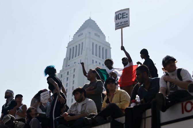People gather during a protest outside a federal building in Los Angeles on Monday.