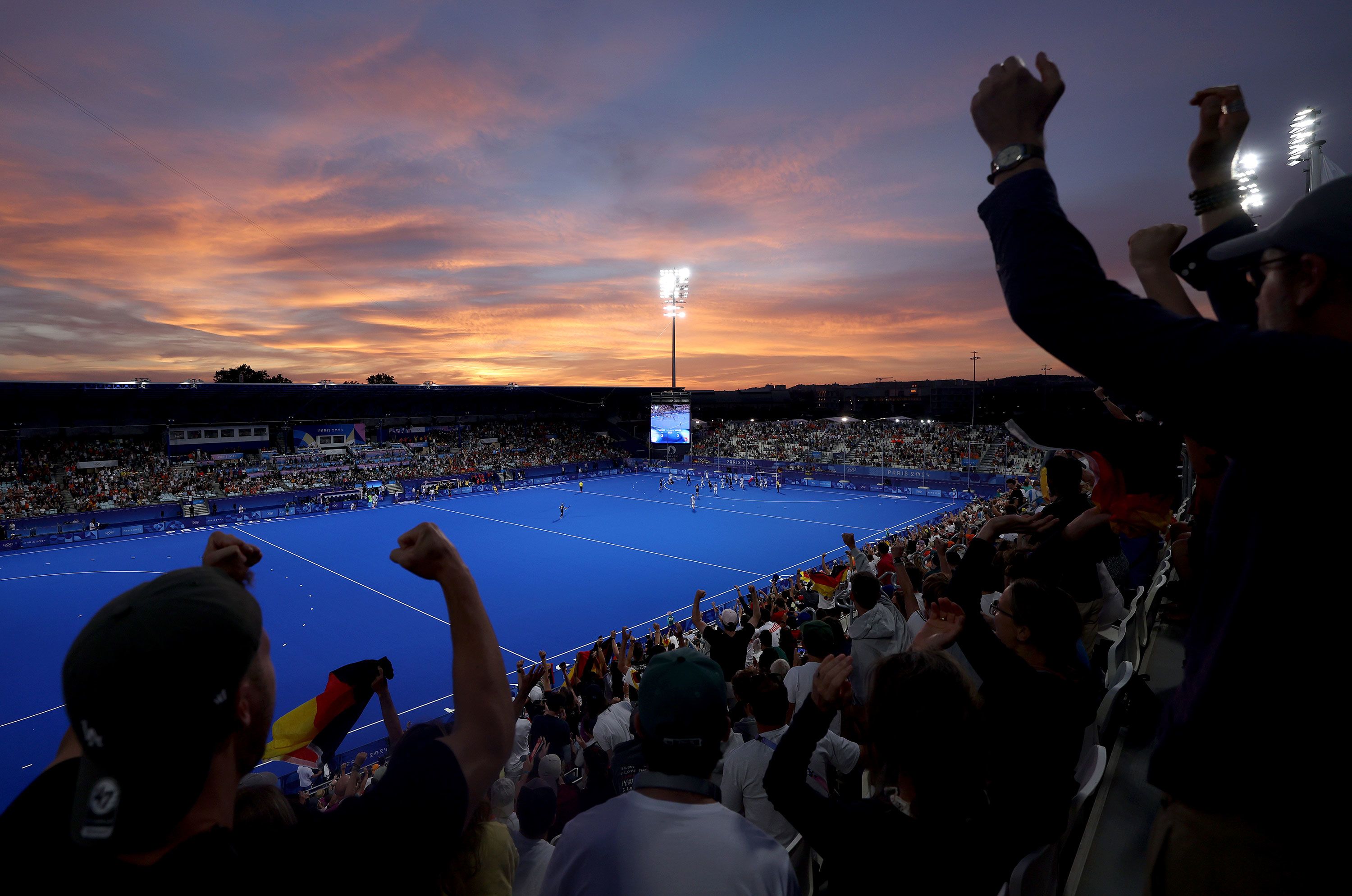 Spectators celebrate Germany's victory over Argentina in a women's field hockey match on August 4.