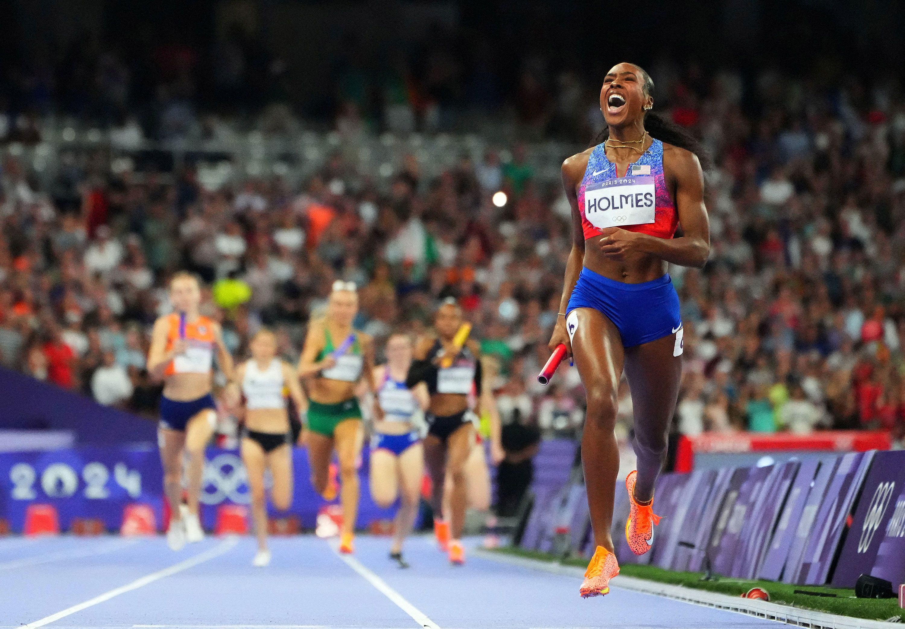 Alexis Holmes of United States crosses the line to win gold in the women's <a href="https://www.cnn.com/sport/live-news/paris-olympics-news-2024-08-10#h_97964e08f95ff74e0bc68039d9a0f1a5">4x400-meter relay </a>final on August 10. The US finished a staggering 50 meters clear of the Netherlands in silver medal position.