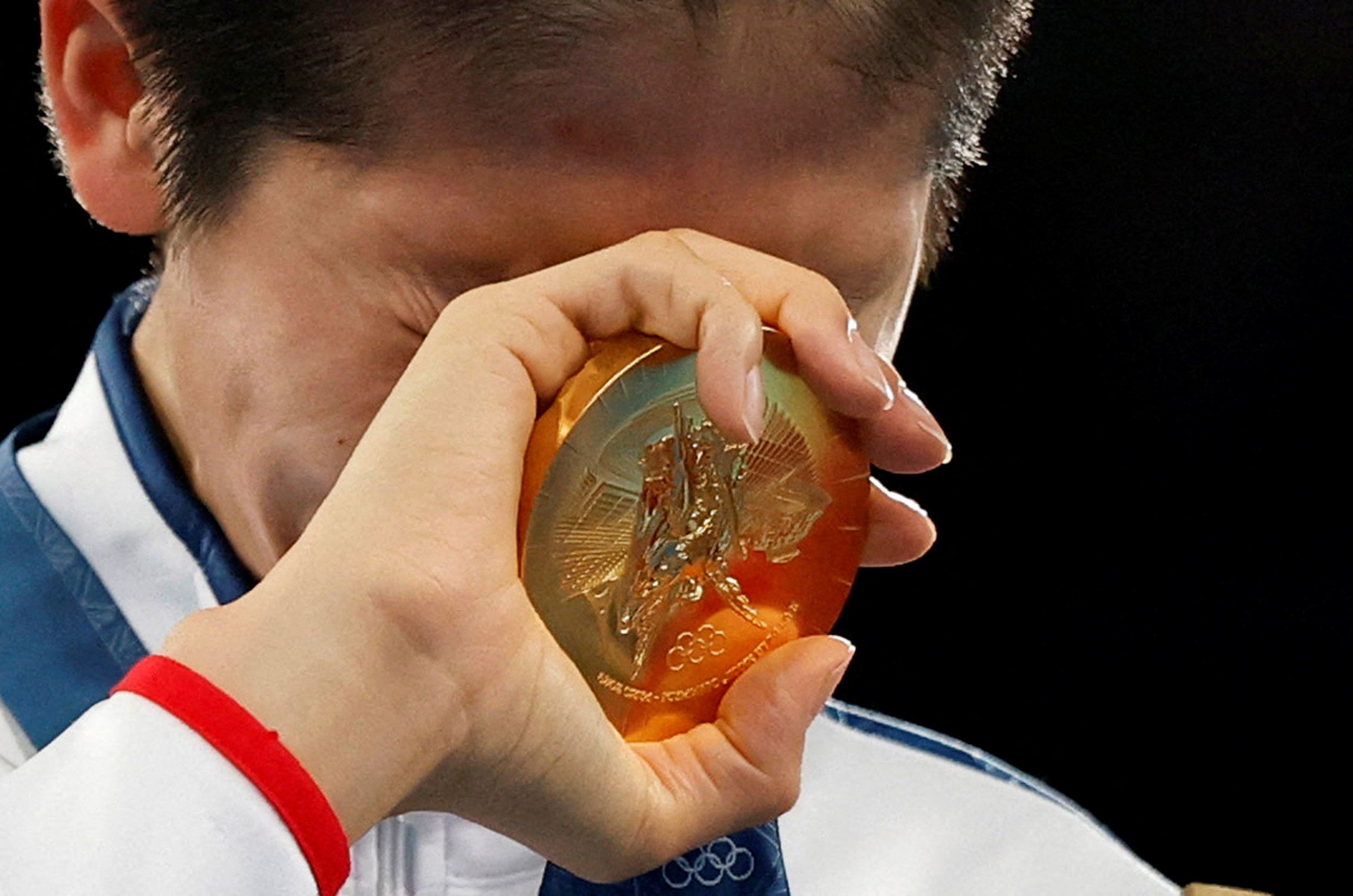 Taiwan's Lin Yu-ting reacts after receiving the gold medal for her victory in the women's 57kg boxing final on August 10.