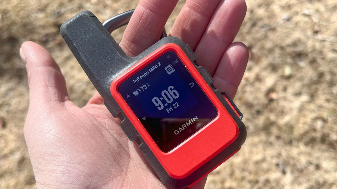 The Garmin inReach Mini 2 in someone's left hand.