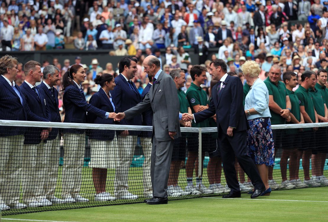 Prince Edward greets line judges and match officials at the end of Wimbledon in 2016.