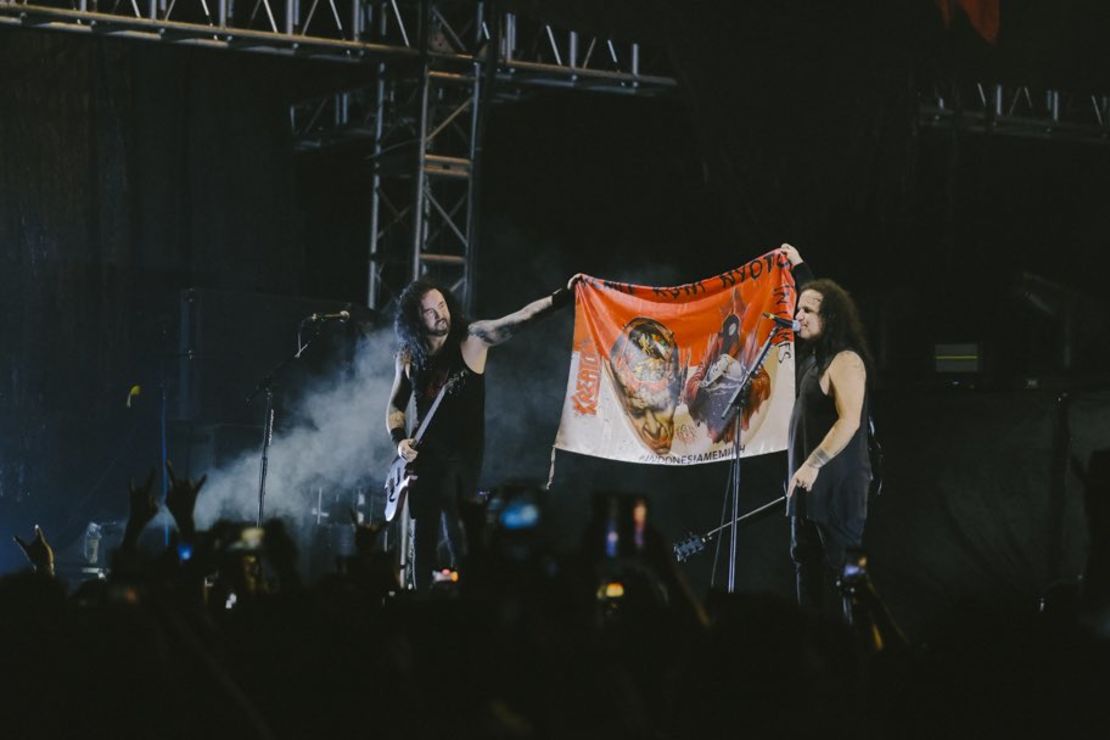 German metal band Kreator holds up a banner during their performance at the Jogjarockarta festival on January 27, 2024.
