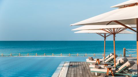 View of a tropical hotel swimming pool in the Maldives