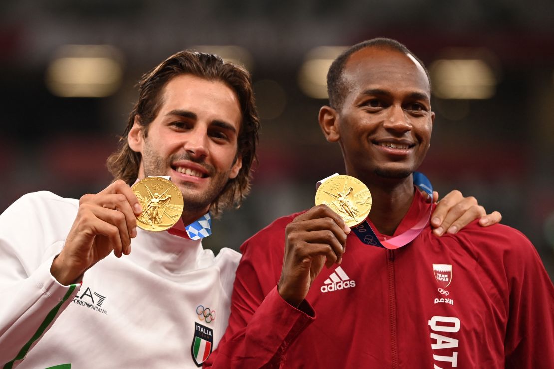 Gianmarco Tamberi (L) and Mutaz Essa Barshim agreed to share the men's high jump gold at the Tokyo 2020 Olympic Games.