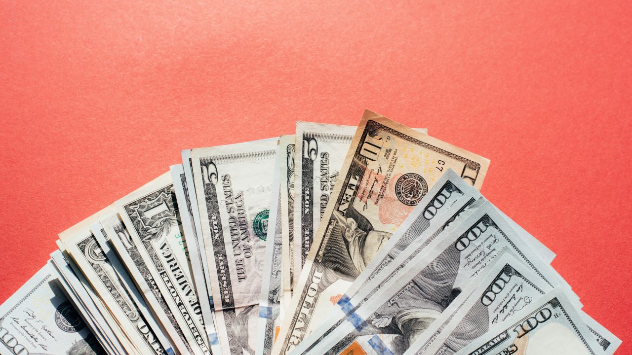 Dollars on a pink background
