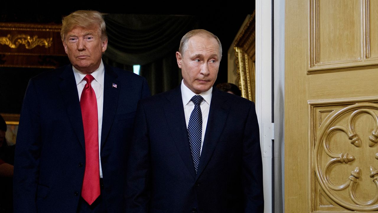TOPSHOT - US President Donald Trump (L) and Russian President Vladimir Putin arrive for a meeting in Helsinki, on July 16, 2018. (Photo by Brendan Smialowski / AFP) (Photo by BRENDAN SMIALOWSKI/AFP via Getty Images)          