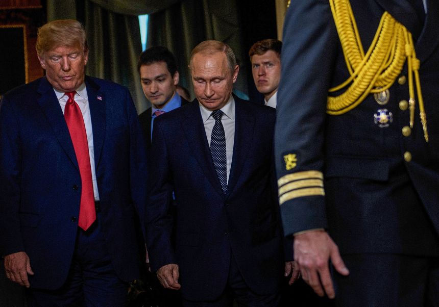 US President Donald Trump and Russian President Vladimir Putin arrive for a meeting at Finland's Presidential Palace in Helsinki, Finland, on July 16, 2018.