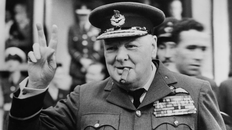 Winston Churchill (1874 - 1965) gives his famous v-sign as he opens the new headquarters of 615 (County of Surrey) Squadron of the RAAF (Royal Auxiliary Air Force) at Croydon, 1948. (Photo by Central Press/Hulton Archive/Getty Images)