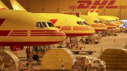 29.08.2018 Saxony, Schkeuditz: DHL cargo aircraft are unloaded at Leipzig/Halle Airport at night. The DHL hub at Leipzig Airport went into operation ten years ago. At that time, 125,000 shipments were handled per day on average, today it is 350,000. the Leipzig hub has developed into the largest within the DHL Express network over the ten years. Meanwhile 5700 people work at the location, 99 percent of them from the region. In addition to five new aircraft, DHL is planning a flight simulator centre for pilot training and training purposes.