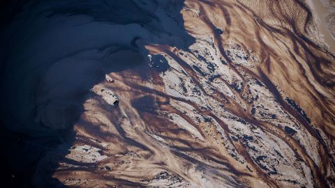 The Suncor Energy Inc. Steepbank mine is seen in this aerial photograph taken above the Athabasca oil sands near Fort McMurray, Alberta, Canada, on Monday, Sept. 10, 2018. While the upfront spending on a mine tends to be costlier than developing more common oil-sands wells, their decades-long lifespans can make them lucrative in the future for companies willing to wait. Photographer: Ben Nelms/Bloomberg via Getty Images