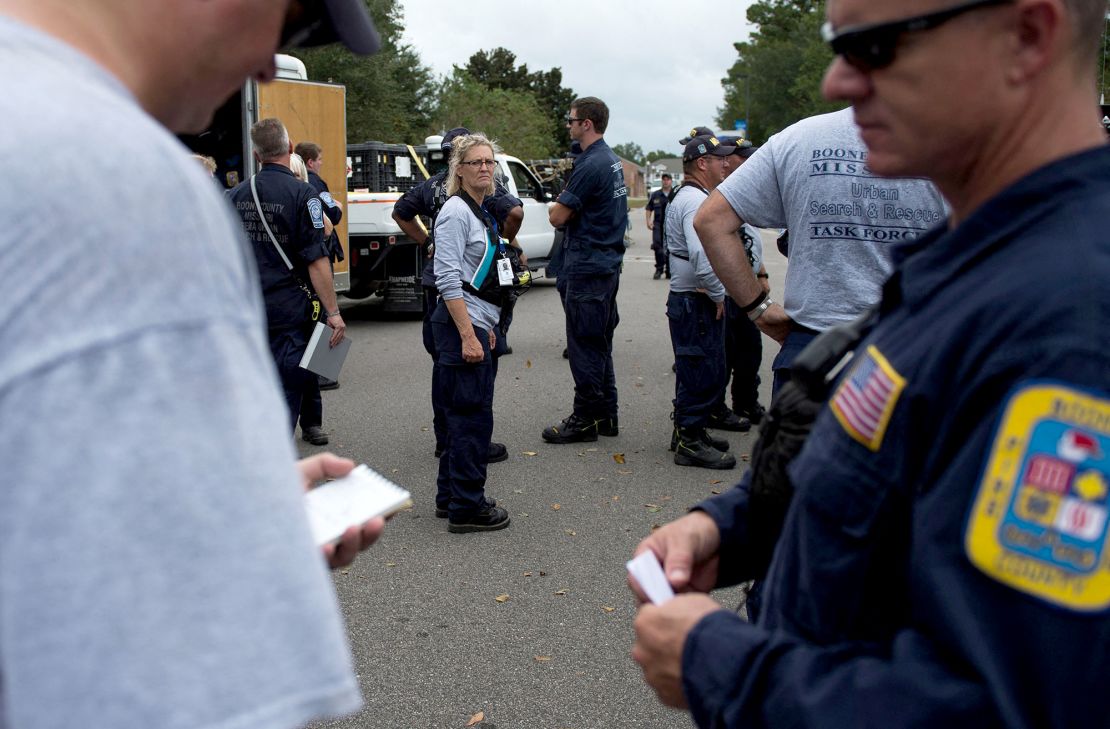 Members of Missouri Search and Rescue, part of FEMA, unload their gear at a staging area as Hurricane Florence starts to make landfall in Lealand, North Carolina, on September 13, 2018.