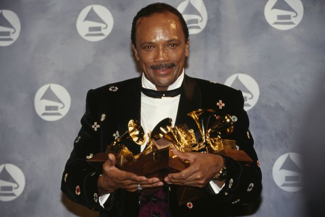 Jones poses with the six Grammys he won in 1991.