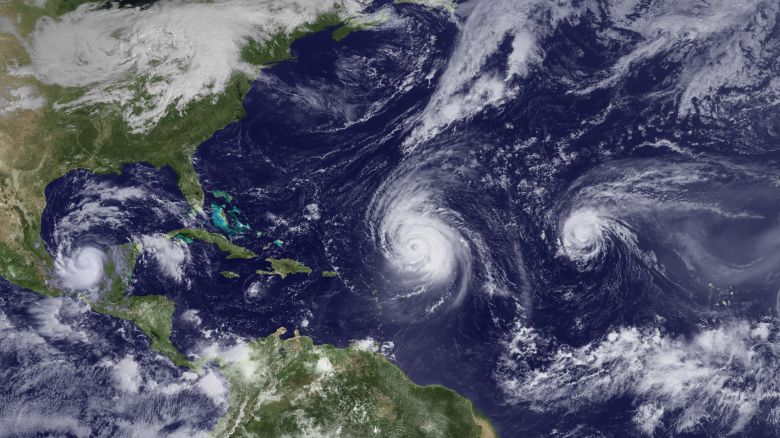 ATLANTIC OCEAN - SEPTEMBER 16:  In this handout satellite image provided by the National Oceanic and Atmospheric istration (NOAA), Hurricanes Karl, Julia, and Igor are seen in the Atlantic Ocean September 16, 2010 as seen from space. Igor is moving slowly northwestward, Julia is weakening as it moves quickly northwestward over open waters of the eastern Atlantic and Karl has become a hurricane.  (Photo by NOAA via Getty Images)
