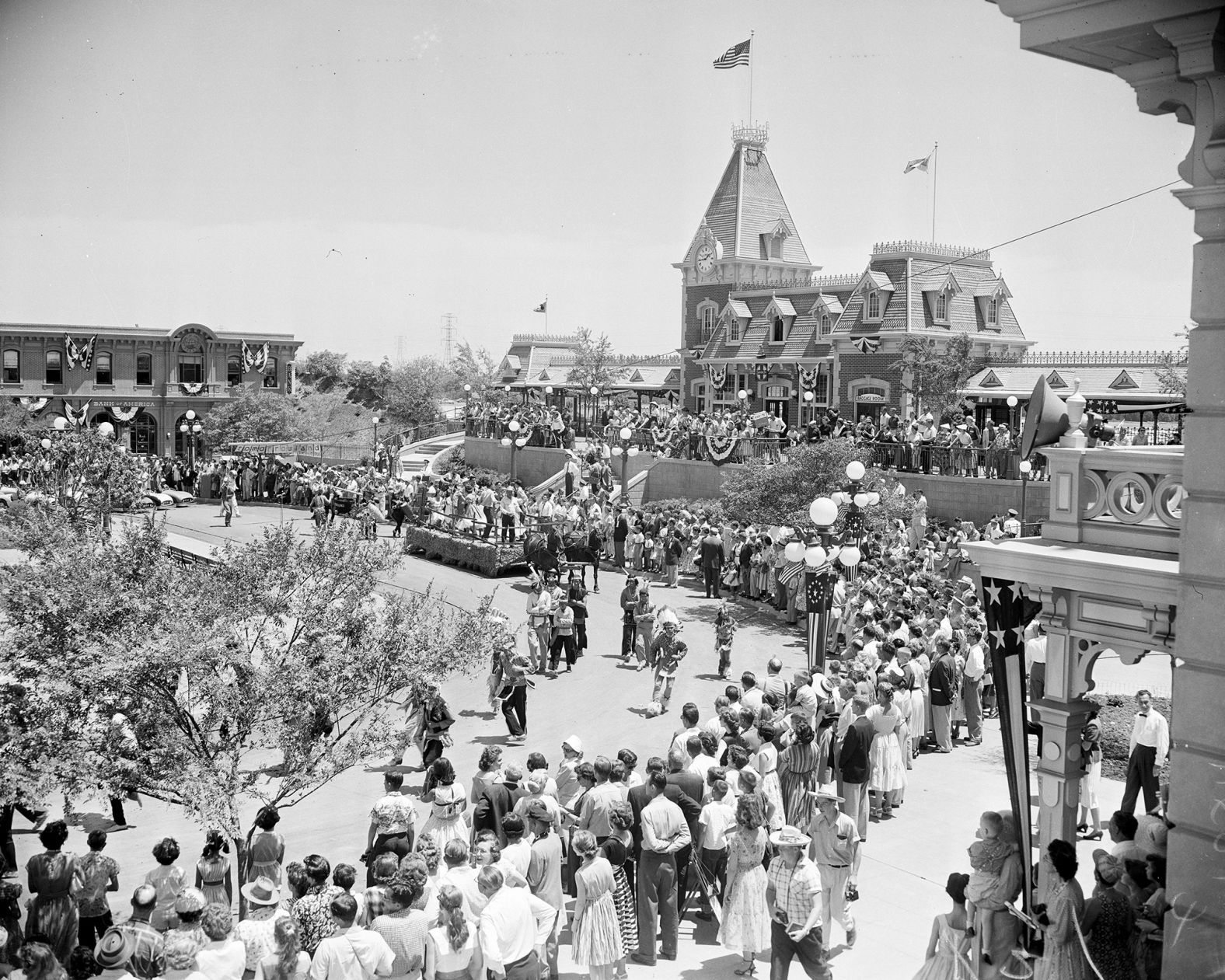 A crowd watches the parade on Main Street.