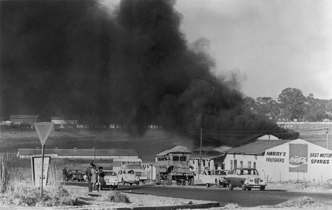 A picture dated August 1976 in Soweto shows buildings burning during a Black students' protest against having to use the Afrikaans language at school.