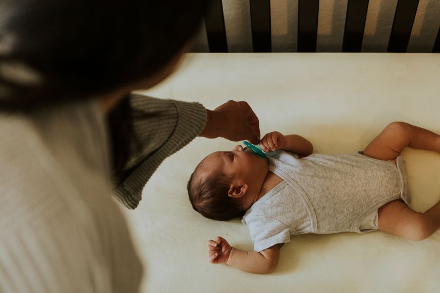 Babies should sleep alone on their backs on a flat, firm mattress.