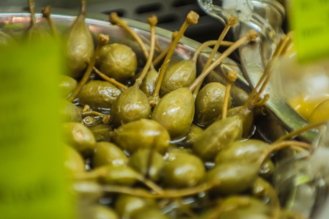 Capers are typically picked by hand, then dried out in salt or pickled in a vinegar solution.