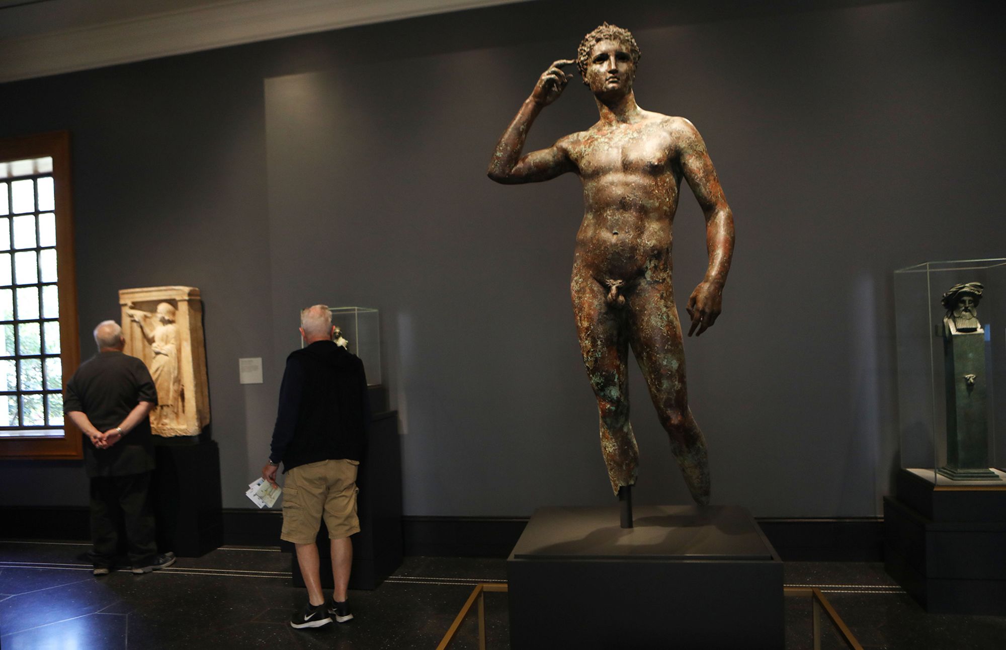 The ancient Greek statue known as "Victorious Youth" (center, right) is displayed at the Getty Villa in December 2018 in California. The European Court has found that Italy's claims to the contested bronze are legitimate.