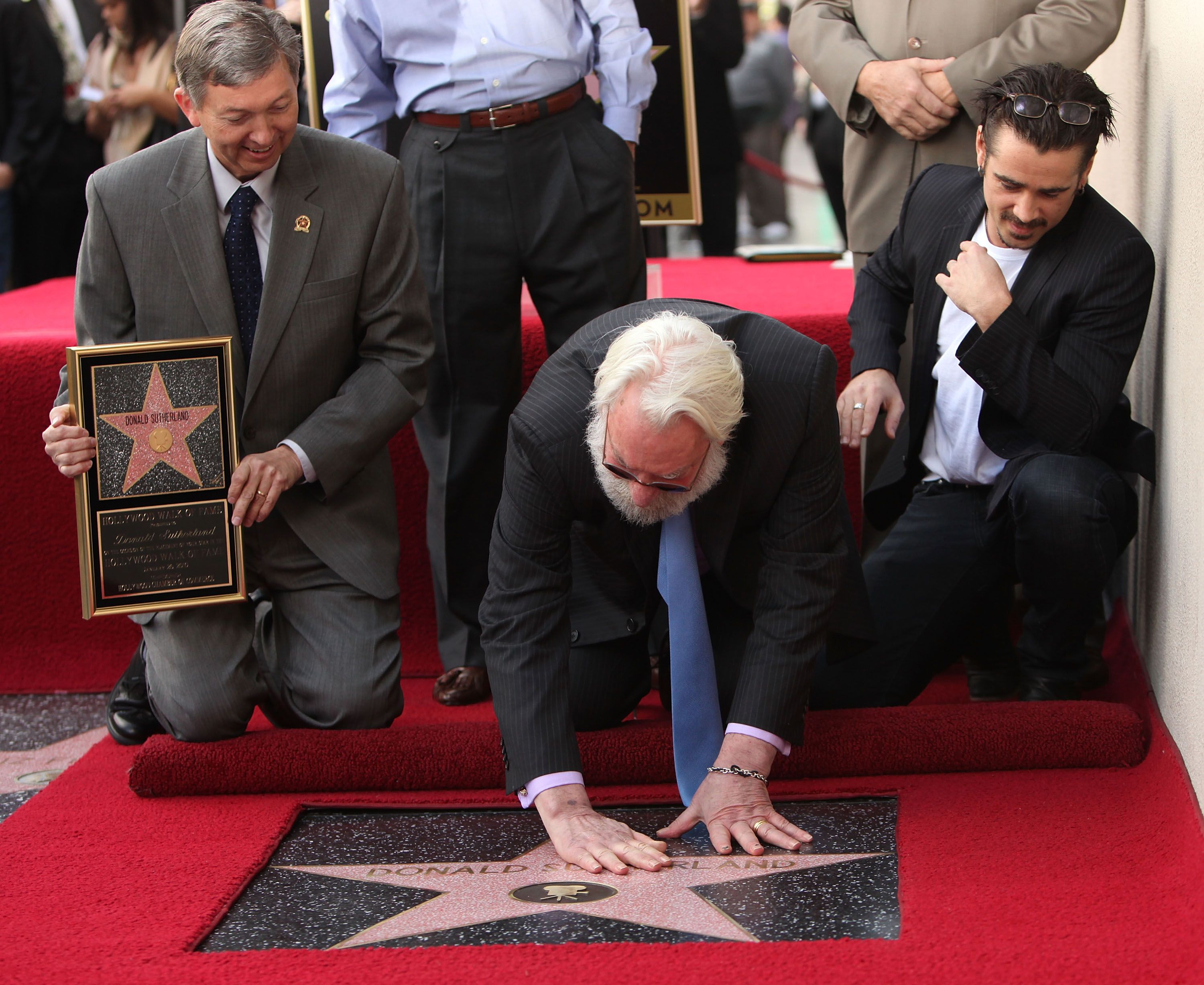 Sutherland, joined by Leron Gubler and Colin Farrell, receives a star on the Hollywood Walk of Fame in 2011.