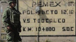 TLAHUELILPAN, MEXICO - JANUARY 22: Military man guards a close diesel fuel pipeline valve as part of the fuel crisis after an explosion in a pipeline belonging to Mexican Public Oil Company Pemex on January 22, 2019 in Tlahuelilpan, Mexico. In a statement, PEMEX announced that the explosion was caused by the illegal manipulation of the pipeline, as minutes before the accident videos were shot where people could be seen filling drums and car fuel tanks.  (Photo by Hector Vivas/Getty Images)