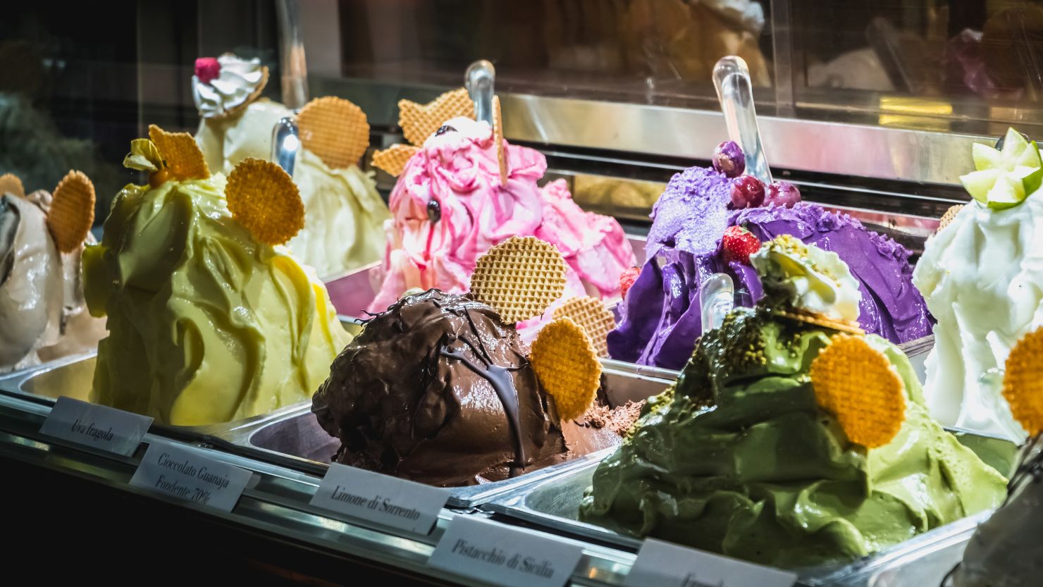 An ice cream shop in Milan at night.