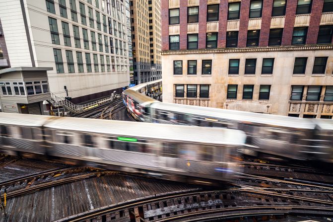 <strong>Elevated status: </strong>Chicago's "L" -- or elevated - rail network opened in 1897 and now extends 103 miles to connect 145 stations, often via tightly curved overhead lines that thread their way through the city's tall buildings.