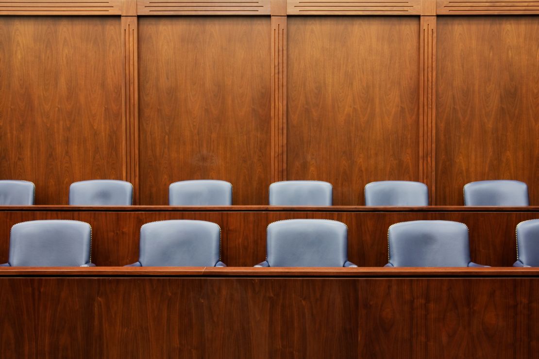 Empty chairs in jury box.