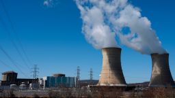 Power lines come off of the nuclear plant on Three Mile Island, with the operational plant run by Exelon Generation on the right, in Middletown, Pennsylvania on March 26, 2019.