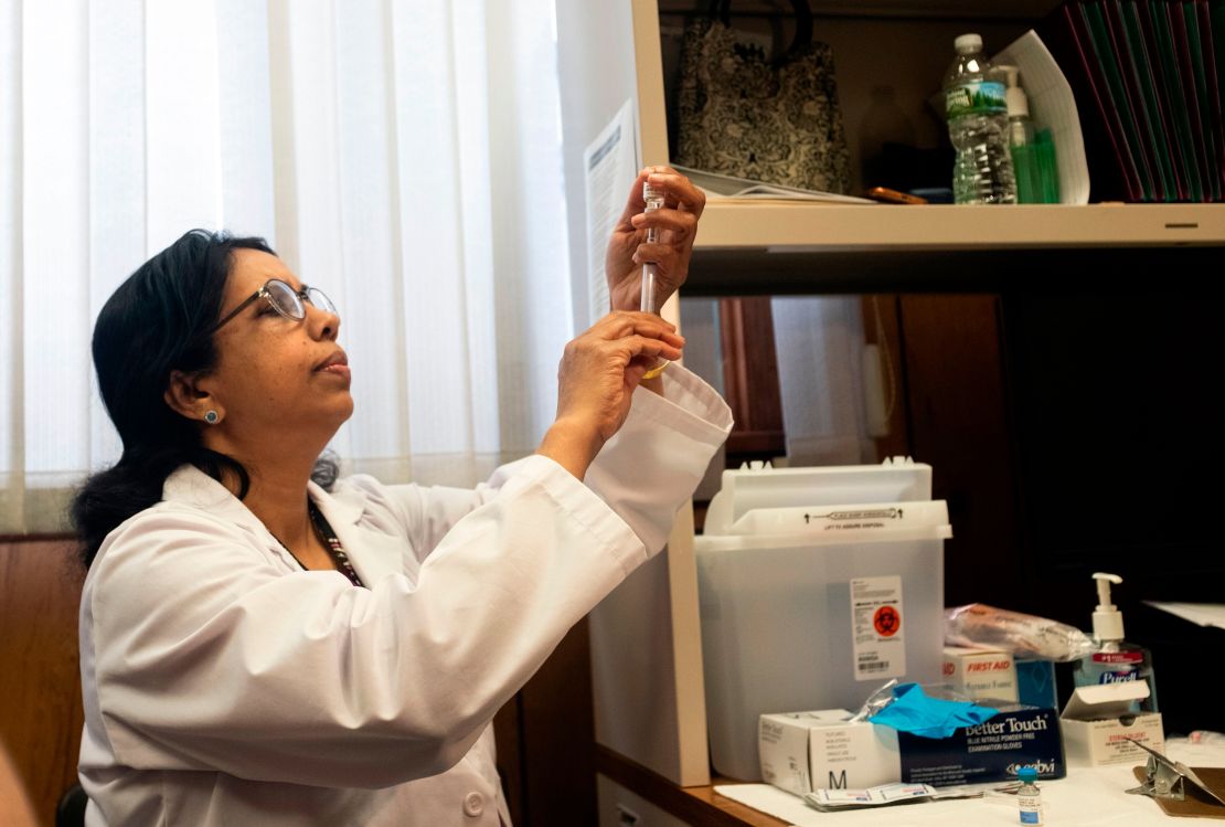 A nurse prepares measles, mumps and rubella vaccine on the Rockland County Health Department in Haverstraw, New York, on 5 April 2019.